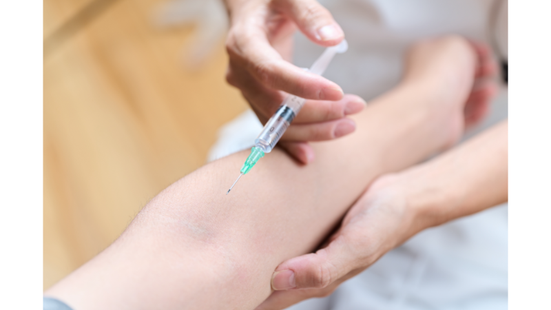 asian doctor making an injection in his arm 2025 03 15 02 49 24 utc 1 1